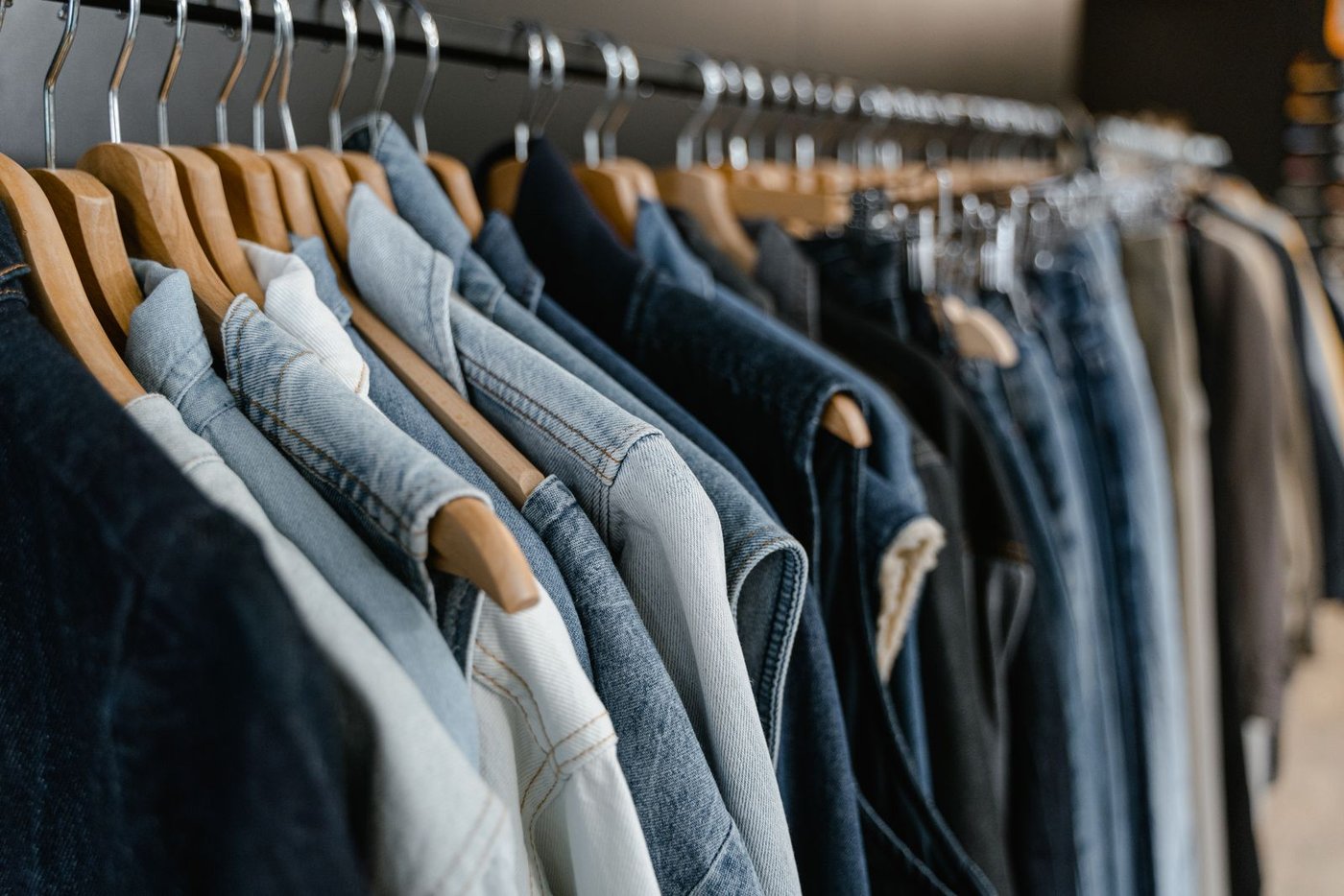 Home Denim garments hanging together on a rail