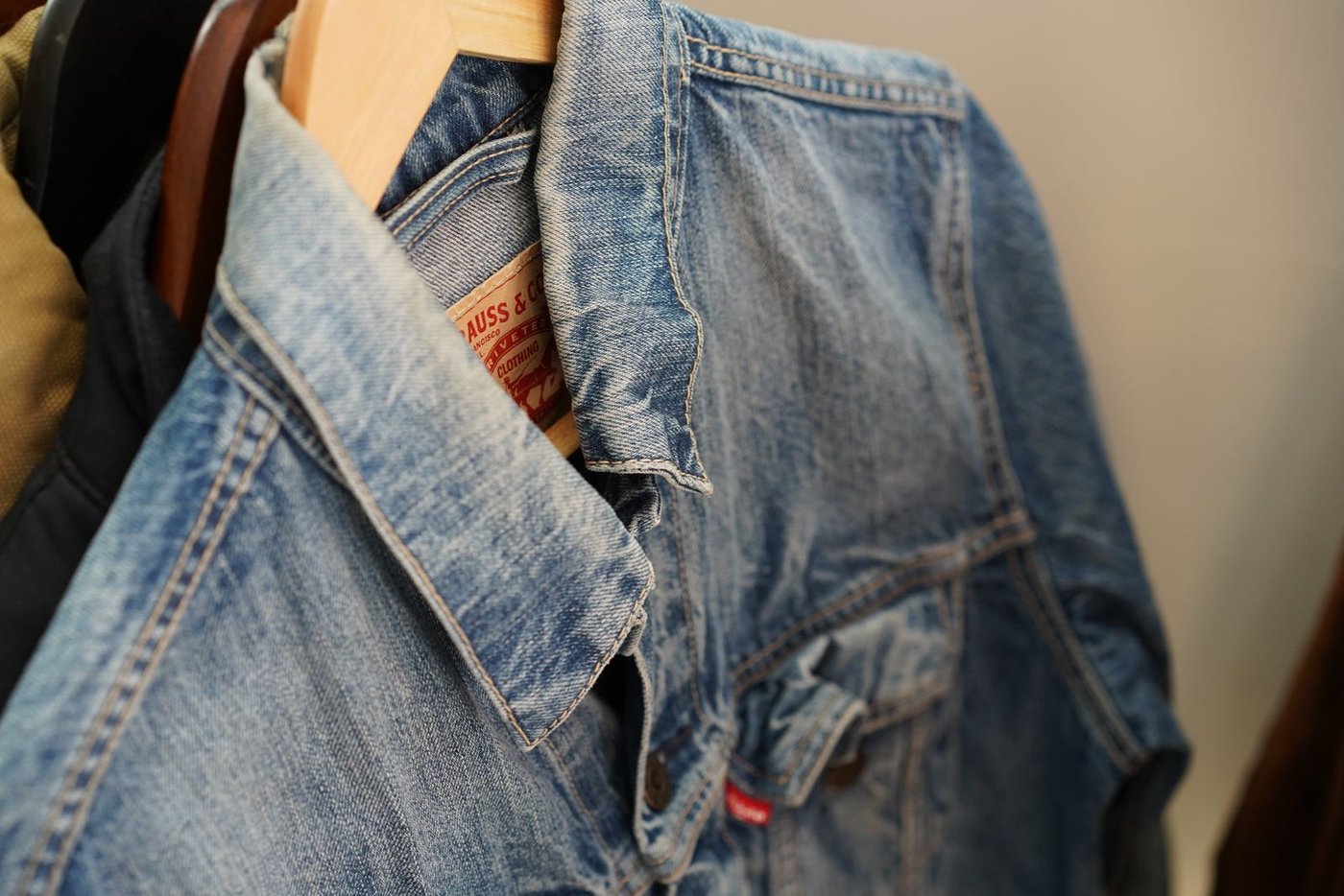 Jacket Hang Closeup Close-up of a denim jacket hanging on a rail