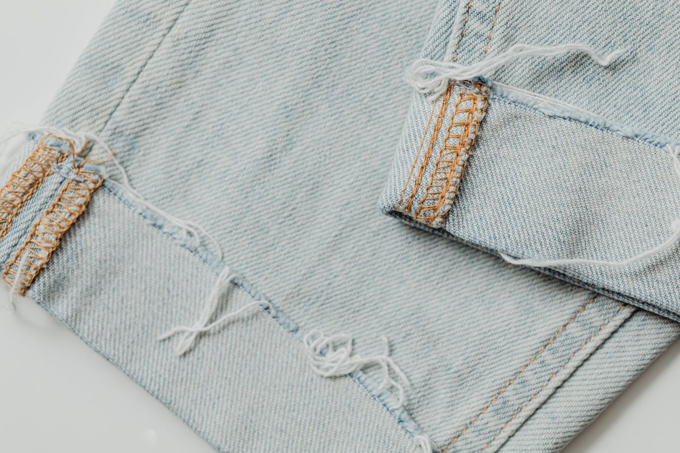 Sizing Guide Light washed denim in close-up