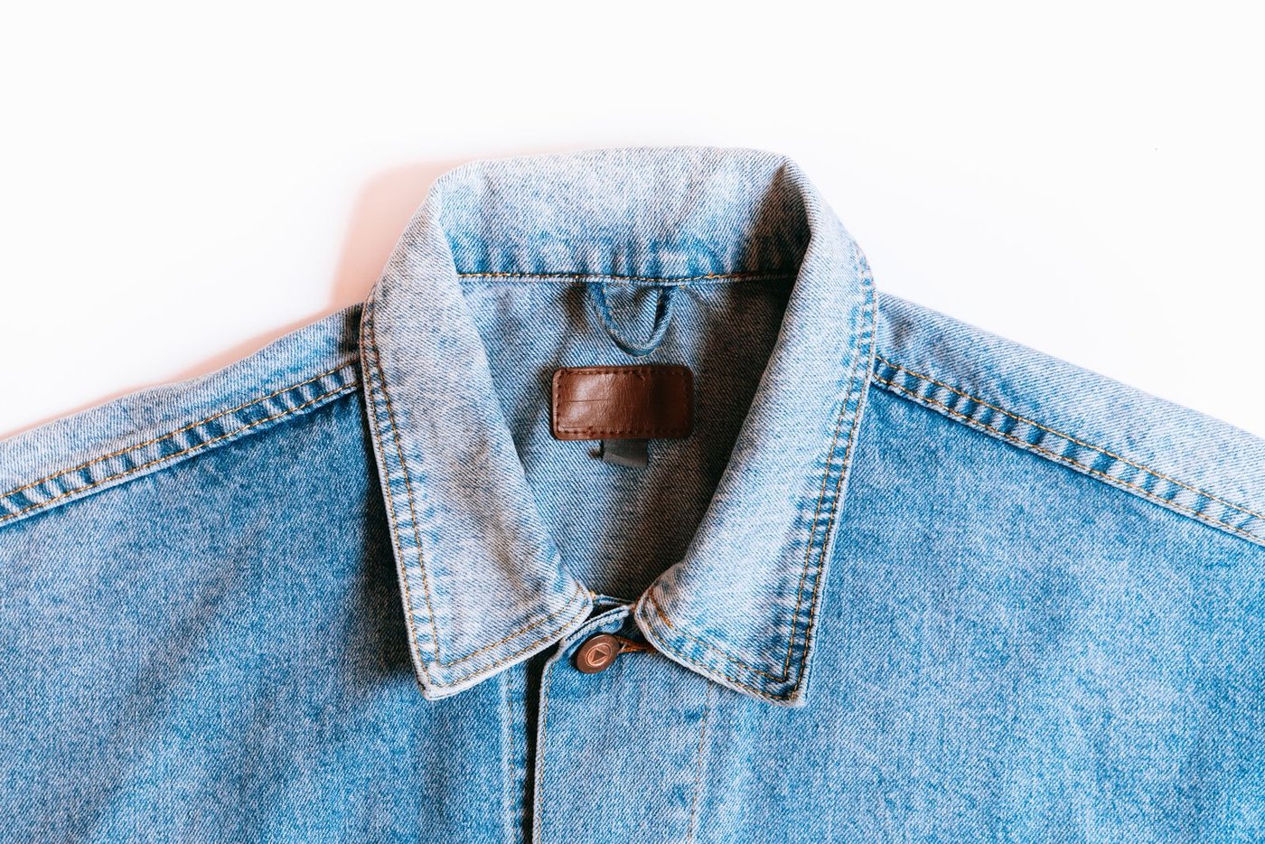 Home Waistband and stitching detail of blue jeans