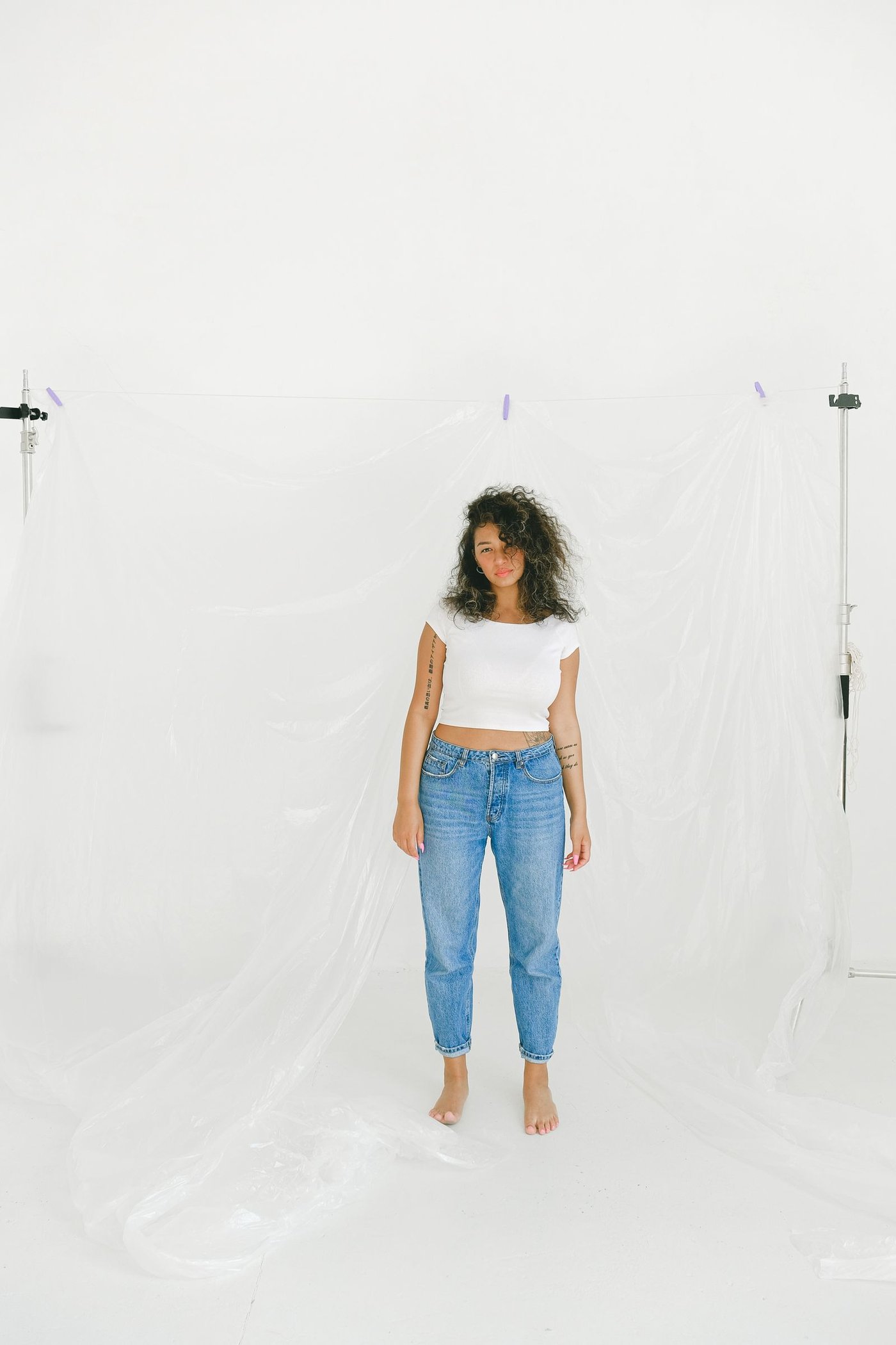 Contact Woman in blue jeans against a white background