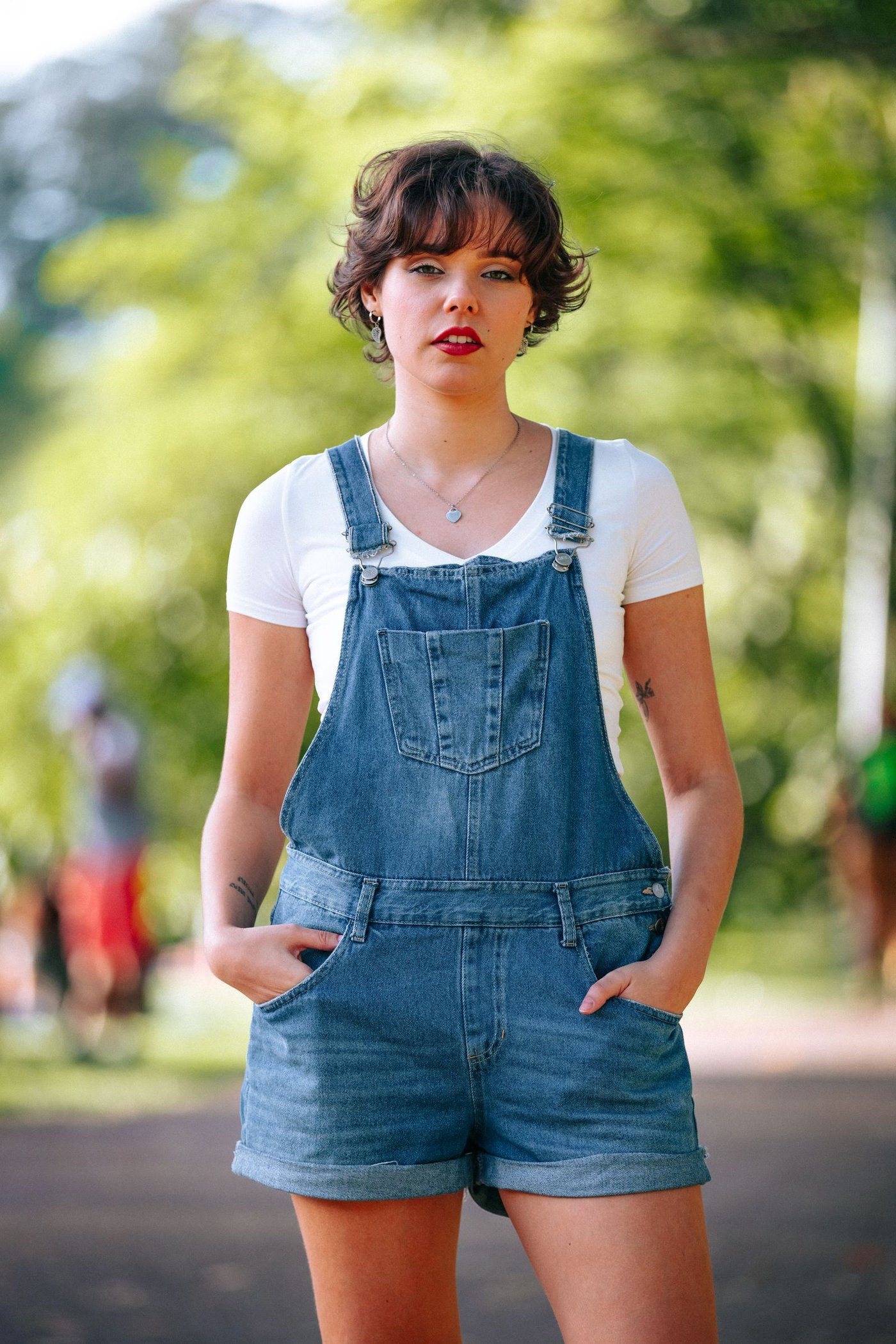 Woman in denim dungarees outdoors