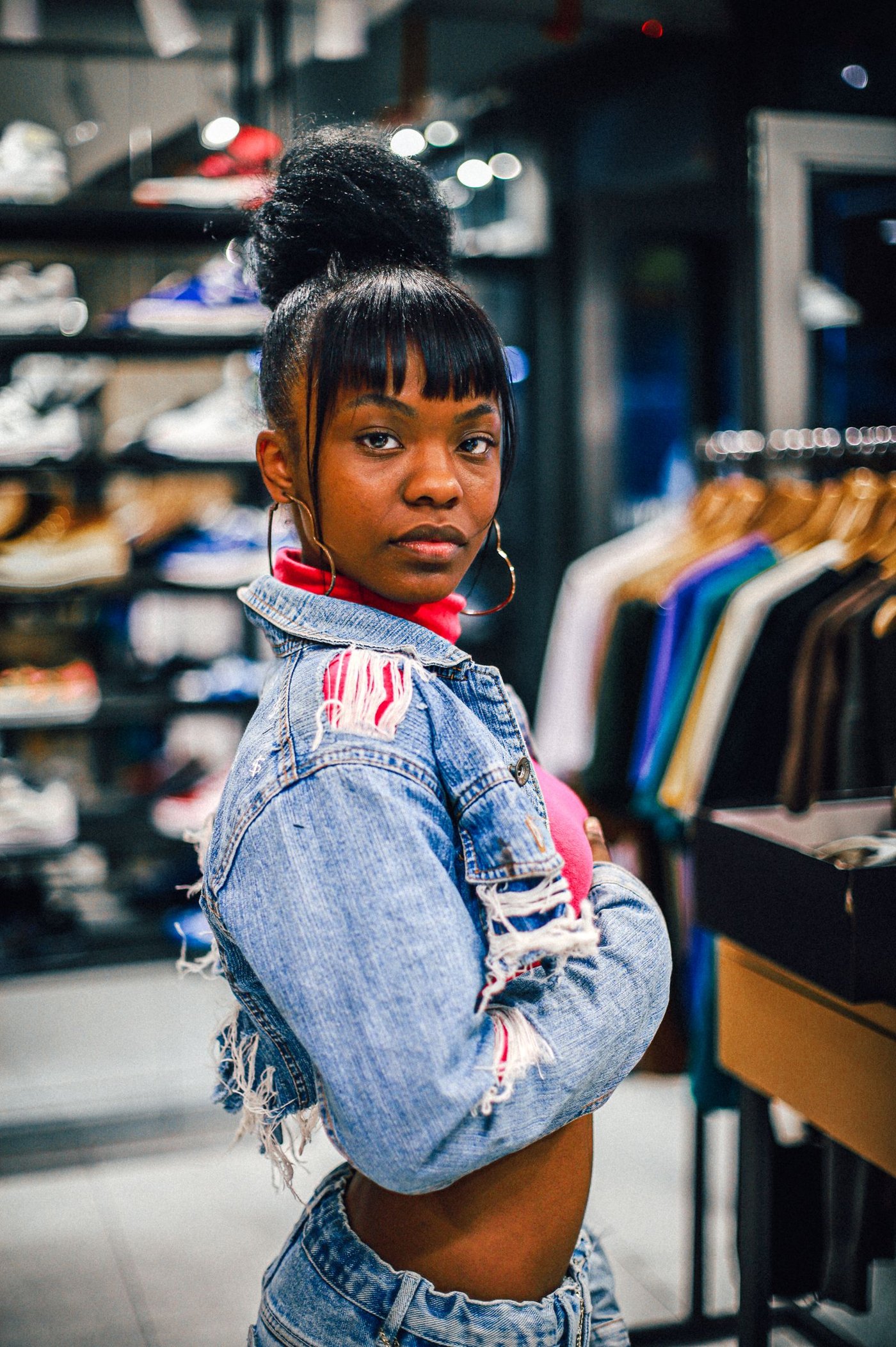 Home Woman in denim browsing a clothing store